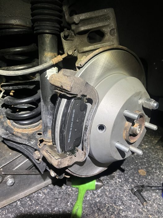 Brake rotor and caliper with the wheel removed during brake service