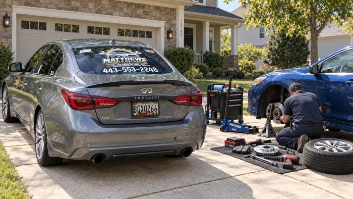 Matthews Mobile Mechanic branded Infiniti beside a driveway service setup